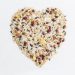 Border frame of Corn kernel seed meal and grains in bags isolated on a white background